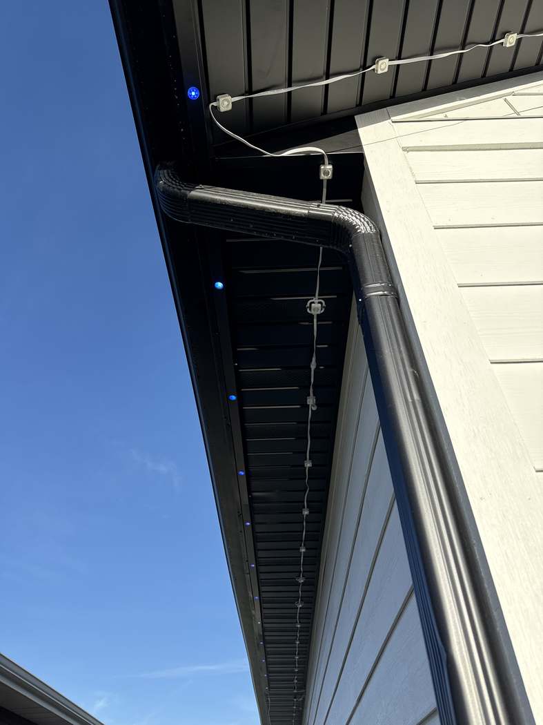 Installed track receding down a soffit, only the lights visible